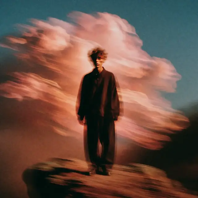 Krea 2 ComfyUI: A lone figure on a cliff under billowing clouds